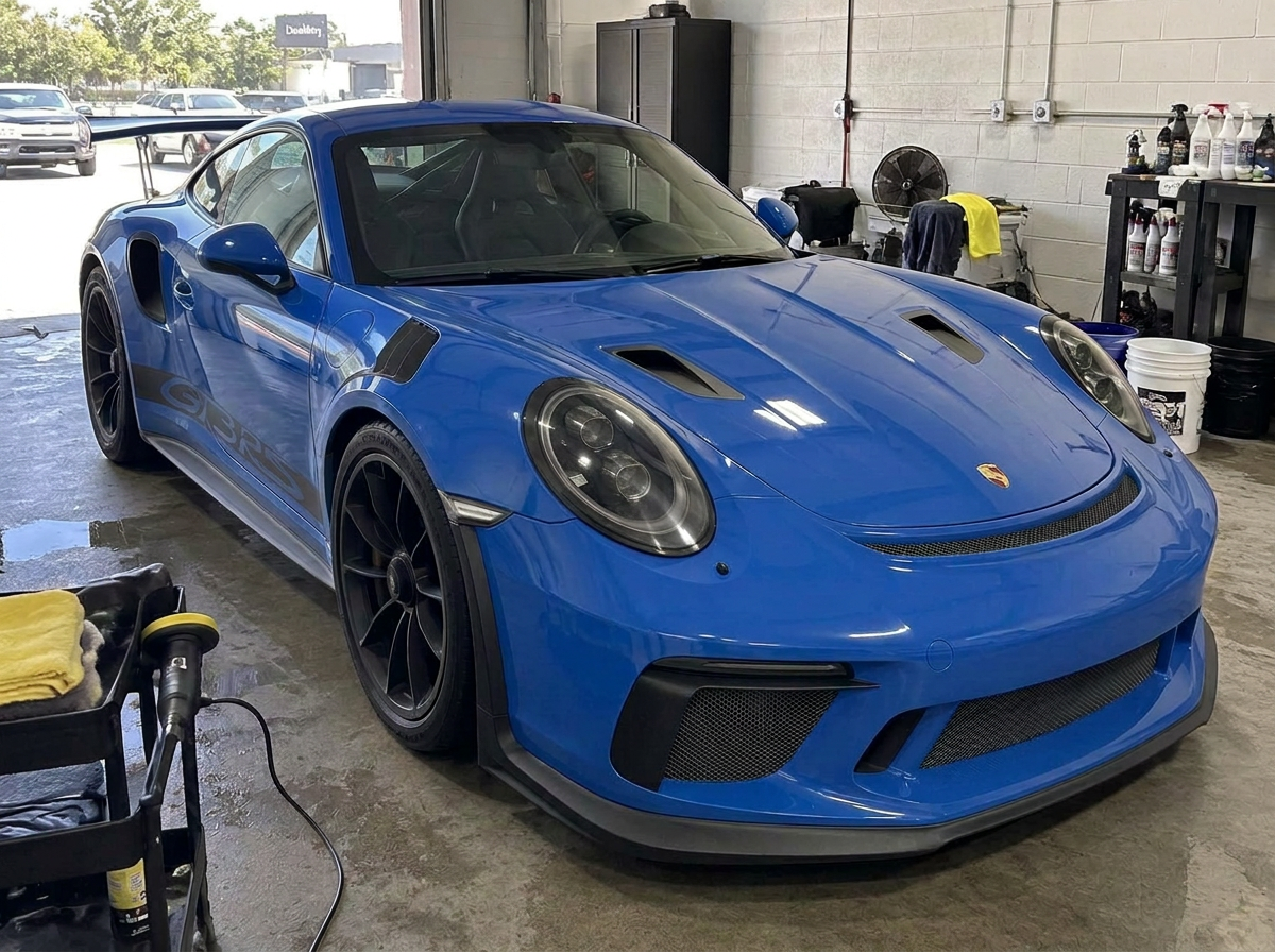 Same blue Porsche 911 GT3 RS after ceramic coating with deep gloss and sharp reflections