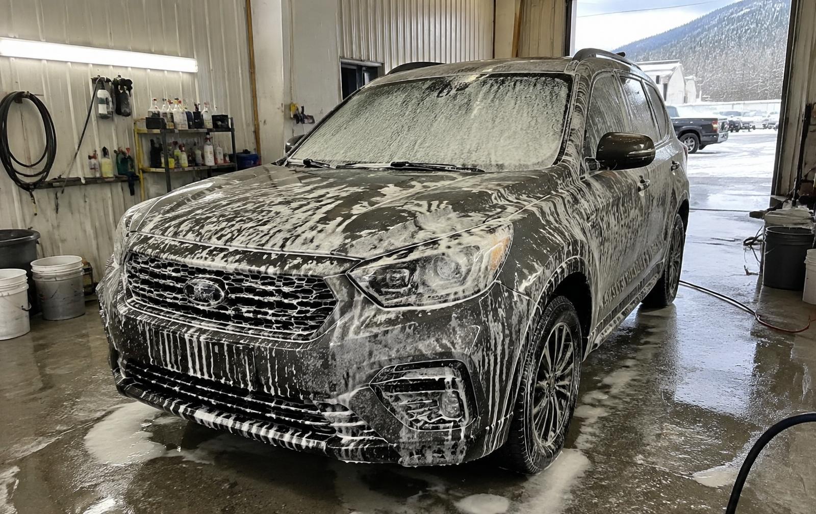 SUV covered in snow foam during exterior detailing in Salmon Arm
