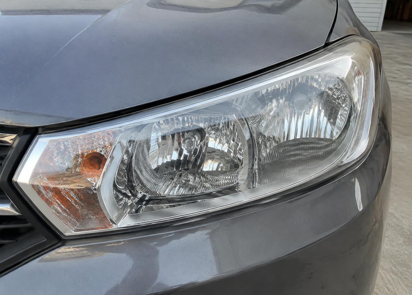 Clear automotive headlight after professional restoration