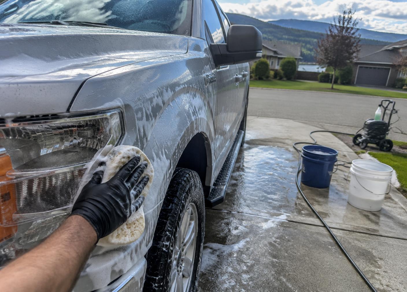 Pickup truck hand washed during mobile detailing