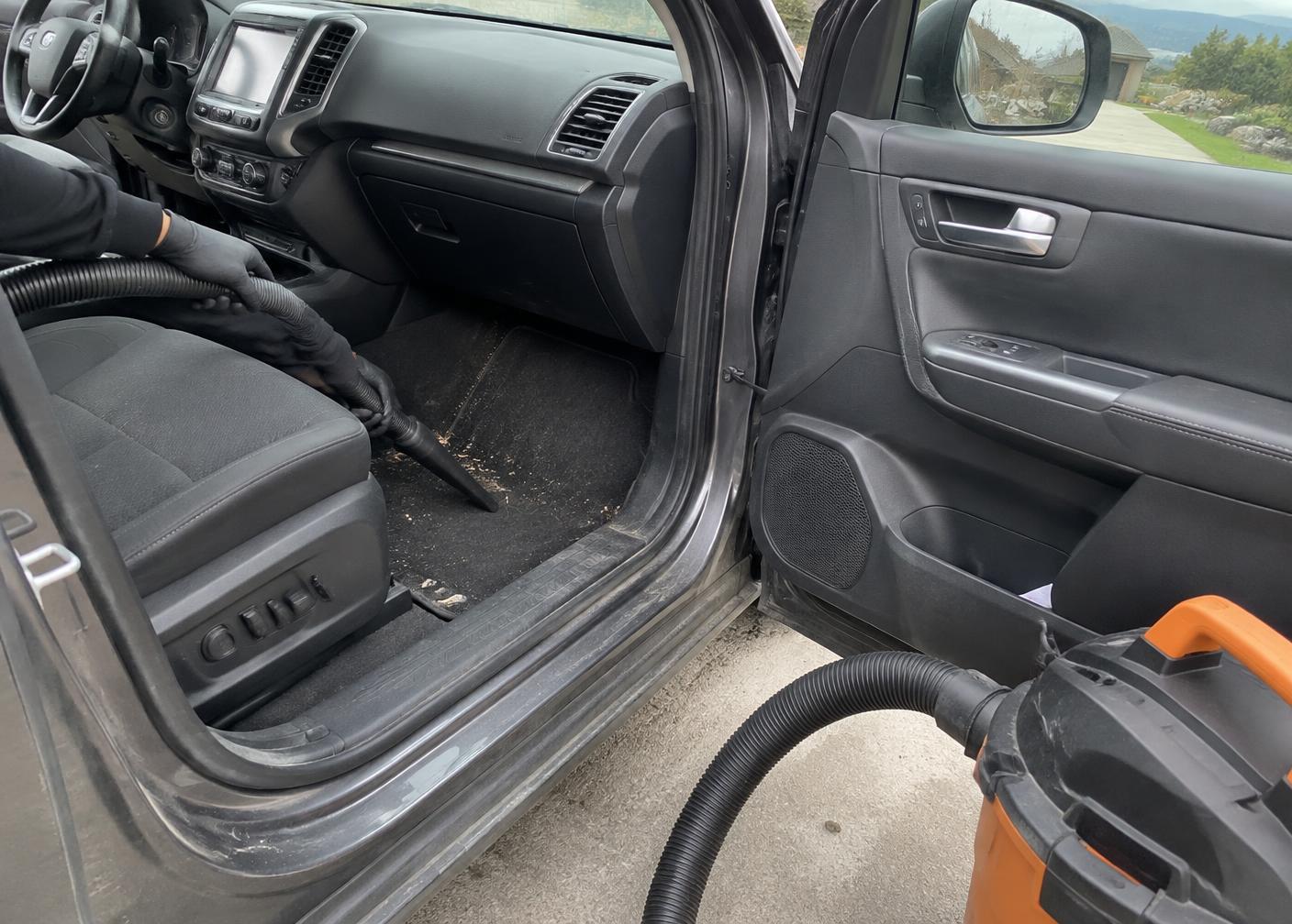 SUV carpet vacuumed during a mobile interior detail