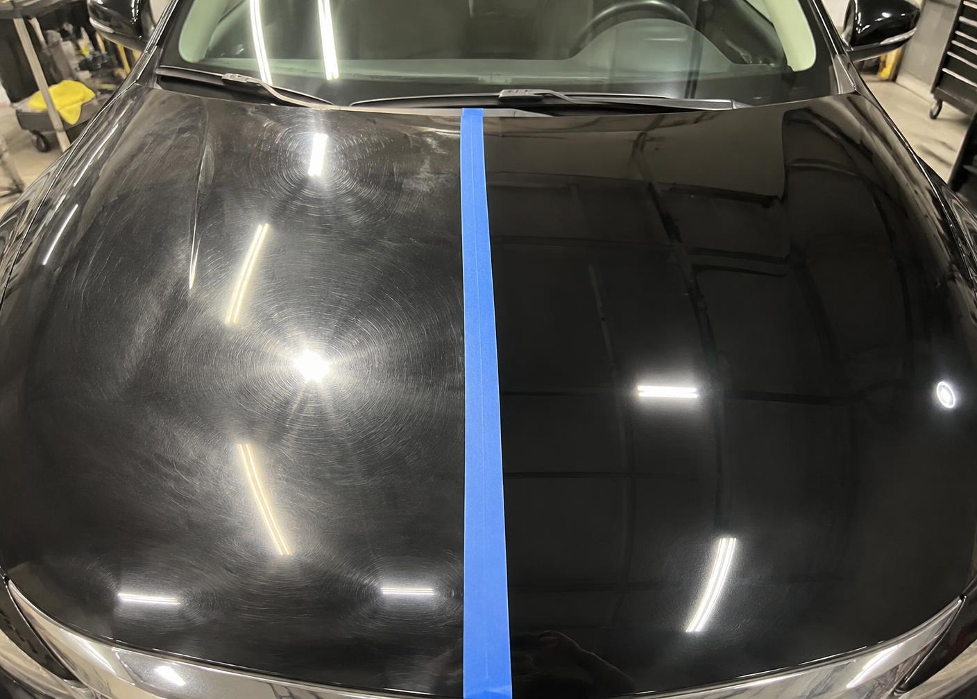Paint correction 50/50 comparison showing swirled and polished sides of a black hood