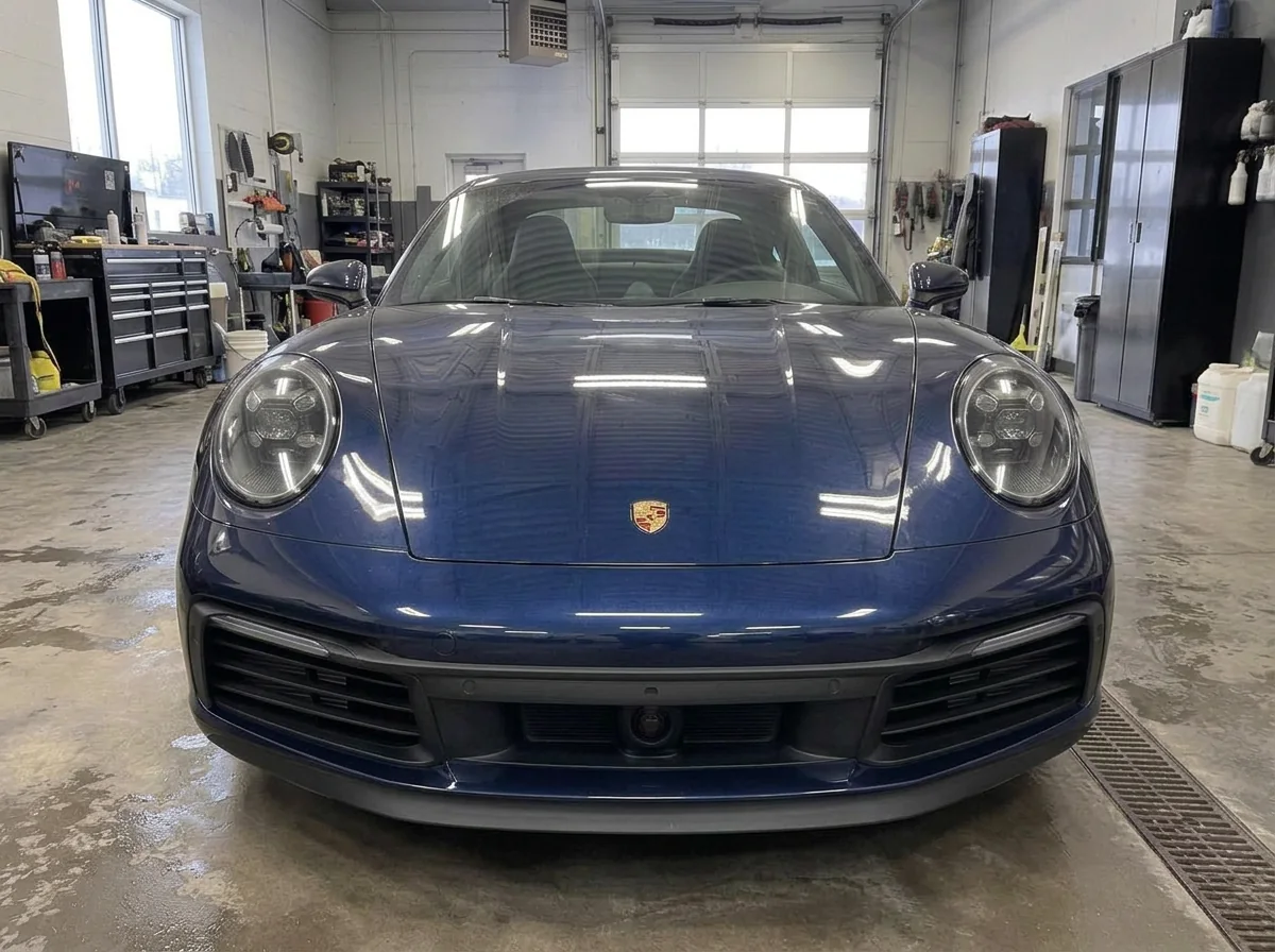 Same dark blue Porsche 911 after paint protection film installation