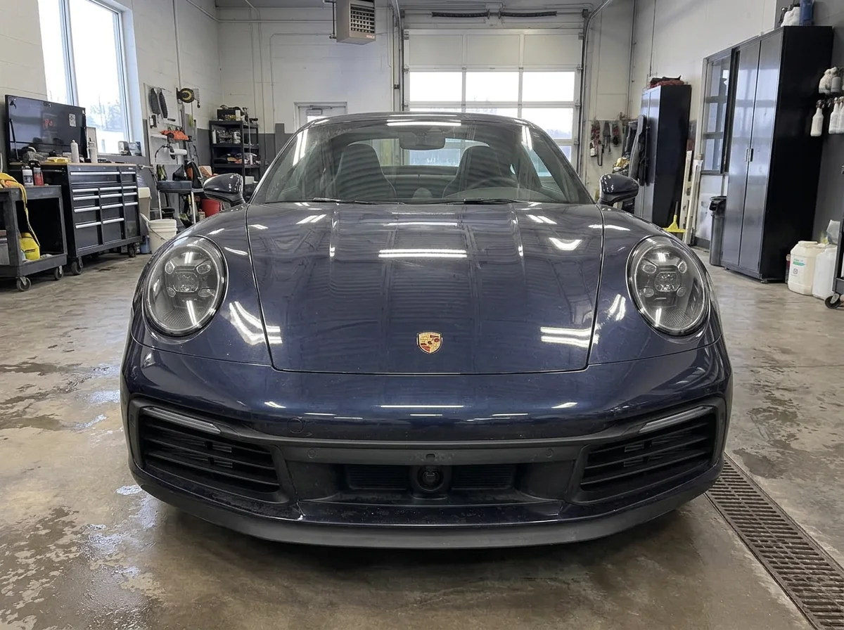 Dark blue Porsche 911 in the shop before paint protection film installation