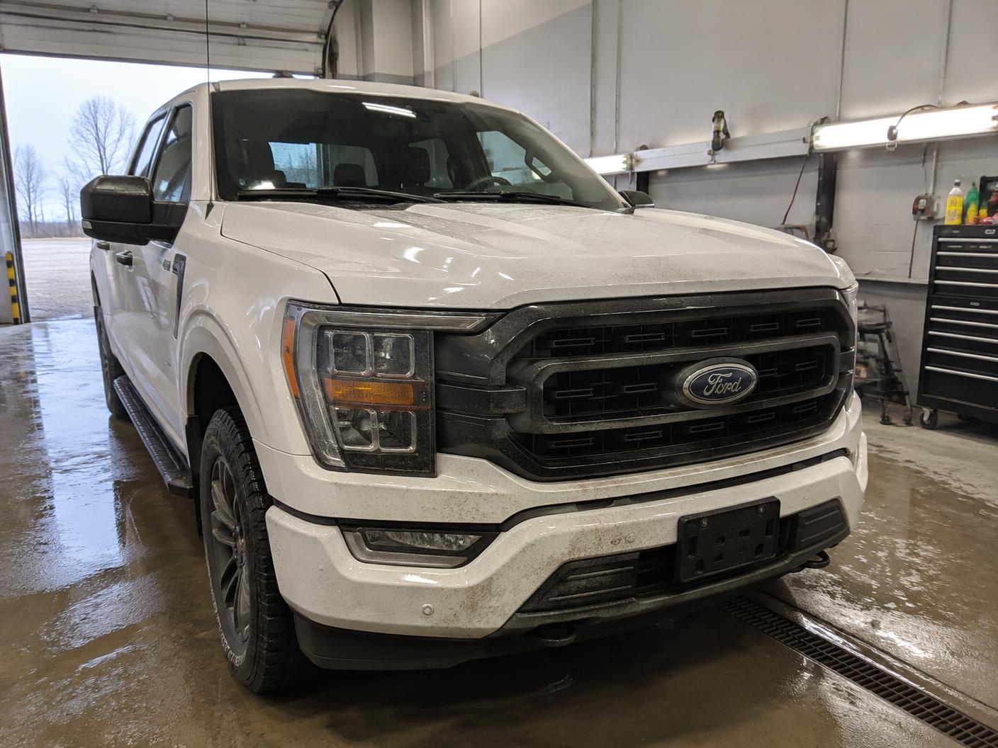 White pickup truck in the shop before paint protection film installation