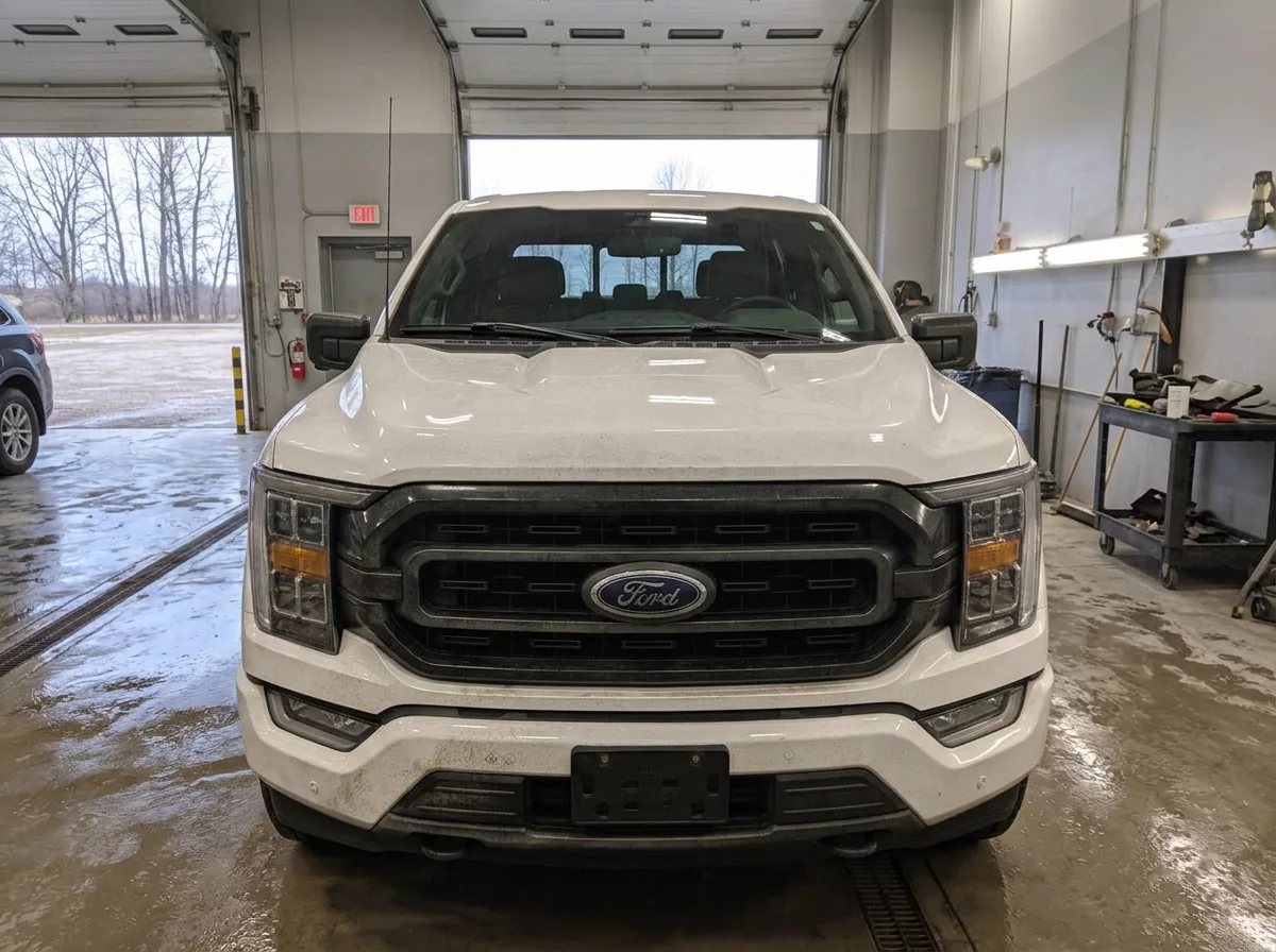 White pickup truck in the shop before paint protection film installation