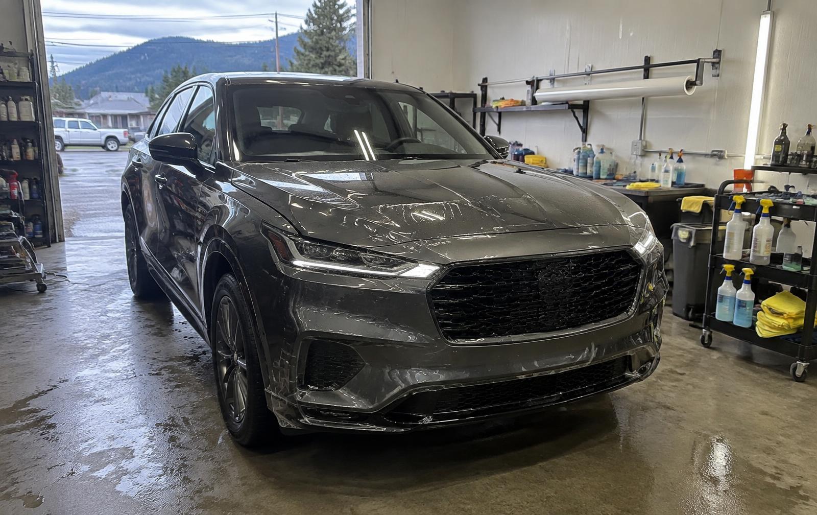 Vehicle protected with paint protection film inside the Dynamic Auto Detailing shop in Salmon Arm