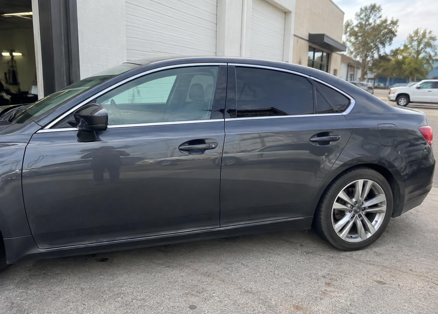 Sedan showing untinted front glass and tinted rear glass