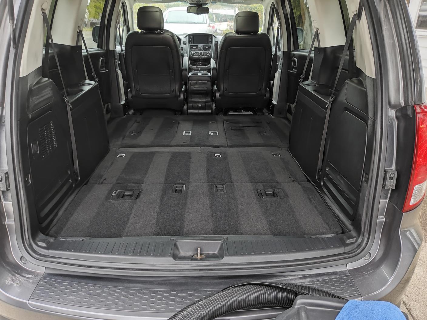 Vacuumed cargo area of a minivan after an interior detail