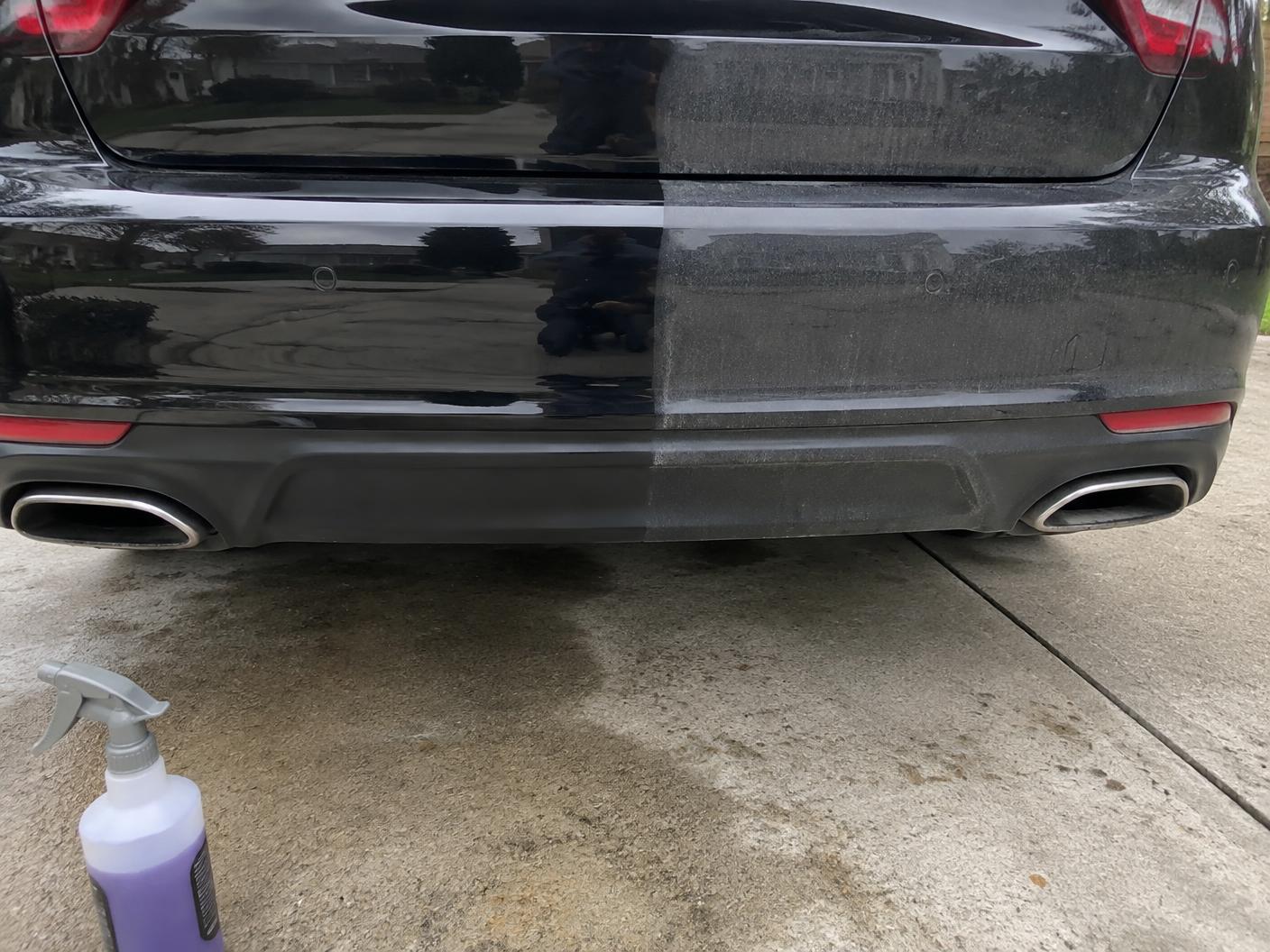 Rear bumper half decontaminated, half still covered in road film