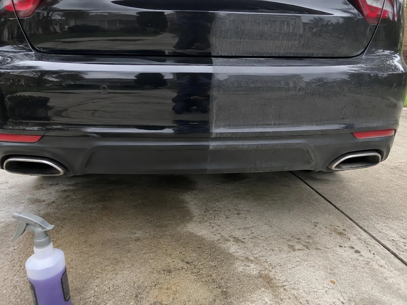 Rear bumper half decontaminated, half still covered in road film