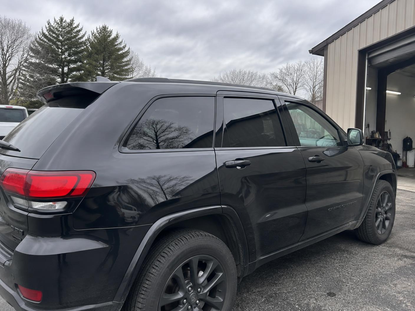 Freshly tinted rear side windows on a dark SUV